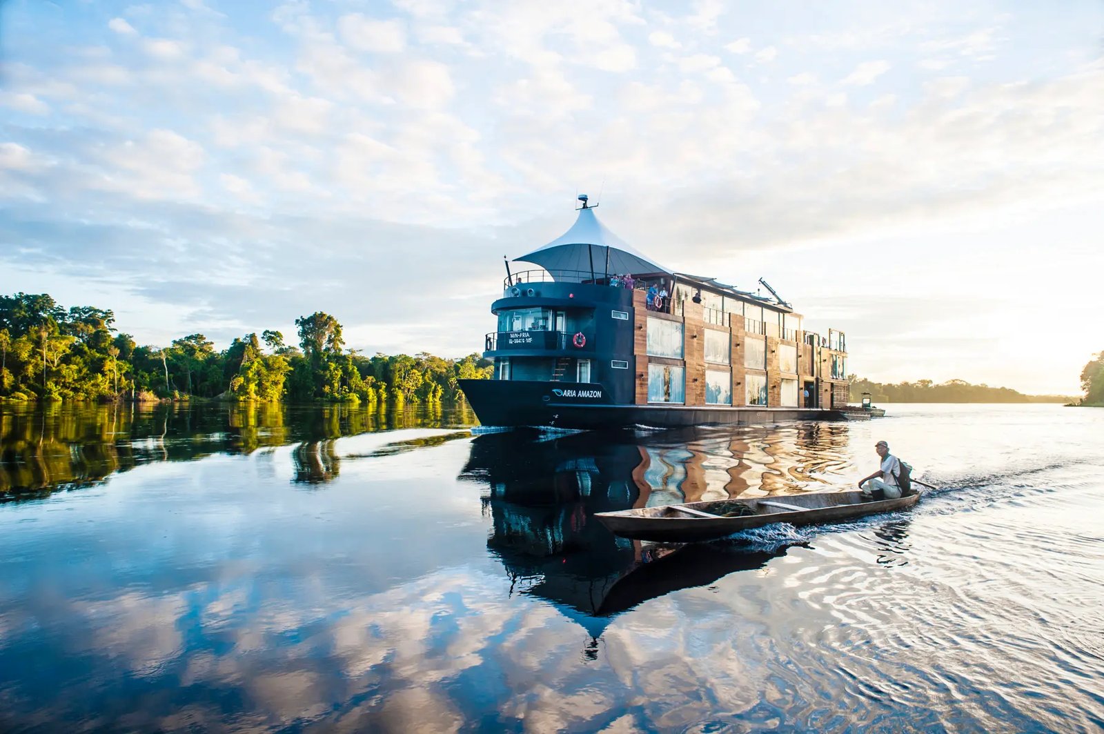 Aqua Expeditions luxury river ship sailing through the Peruvian Amazon rainforest