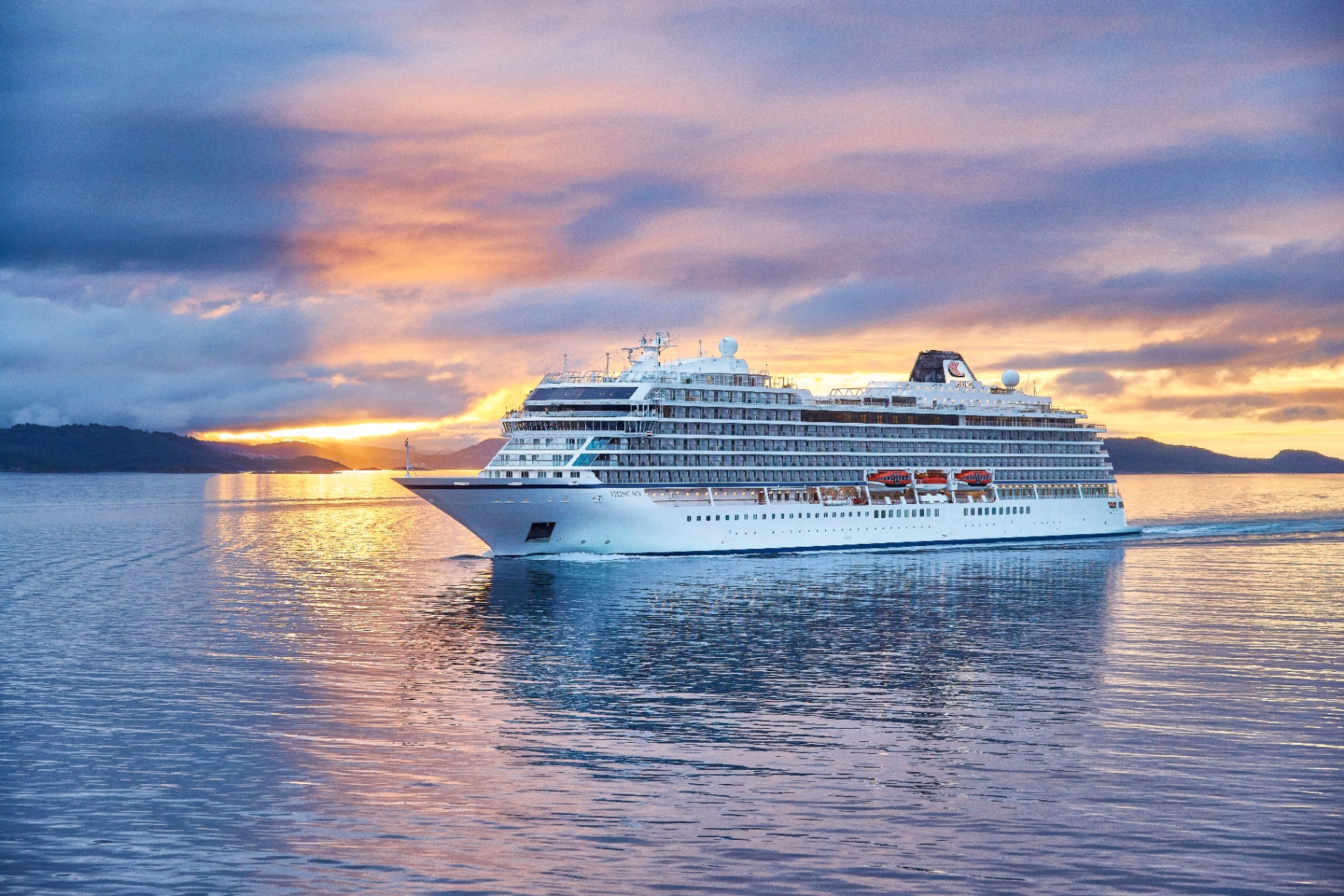 Viking Sky sailing past Norway's Lofoten Islands at sunset