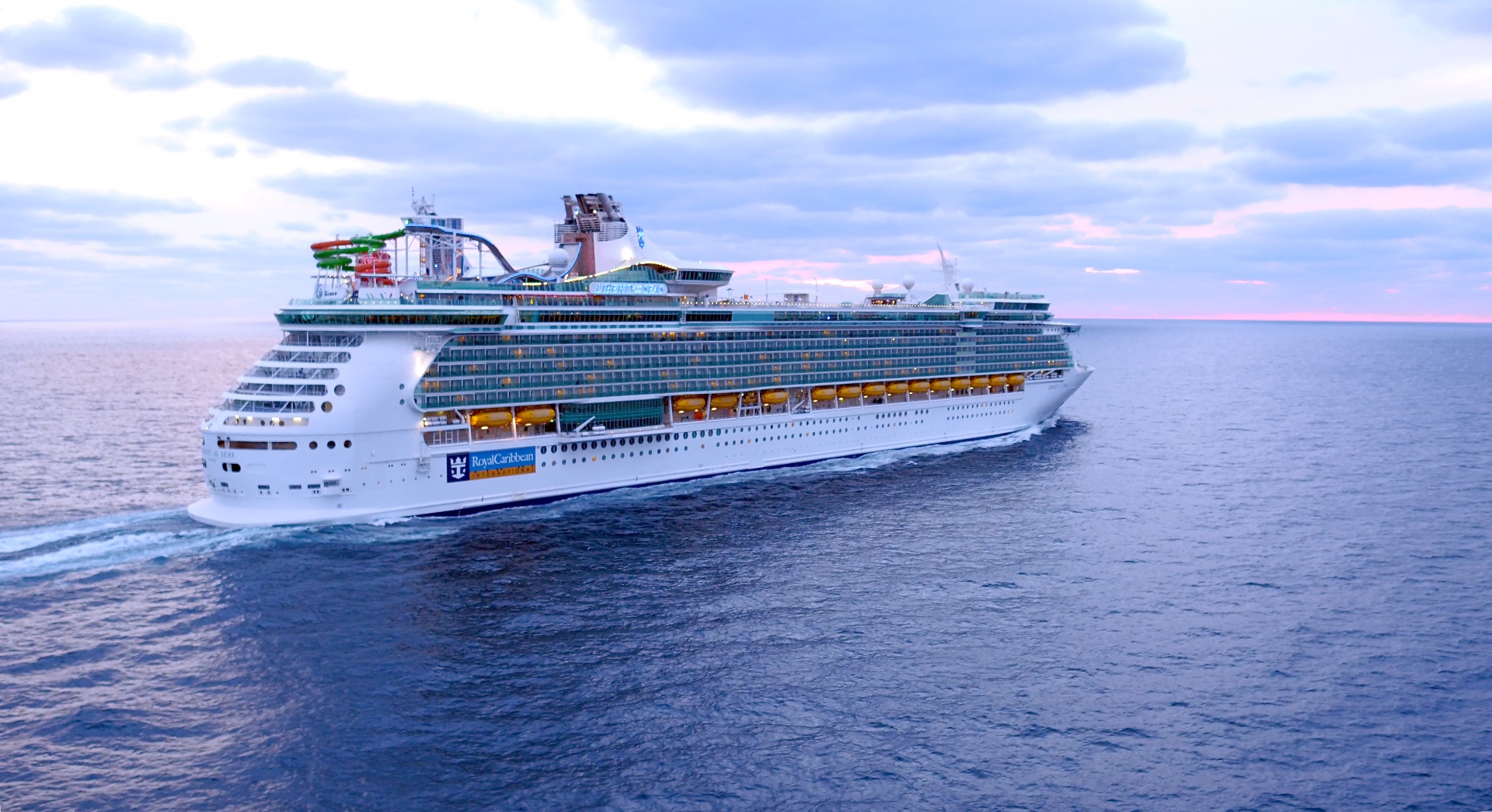 Liberty of the Seas sailing at dusk